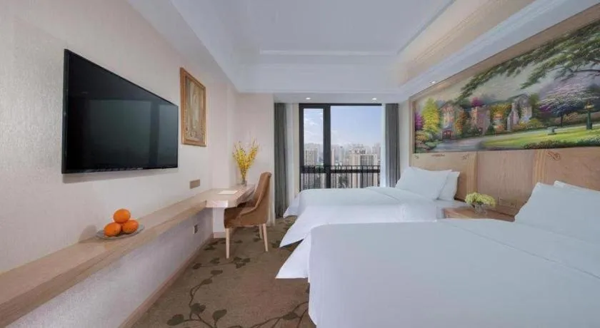 Bed in Vienna Hotel Chongqing Yangjiaping Pedestrian Street Light Railway Station