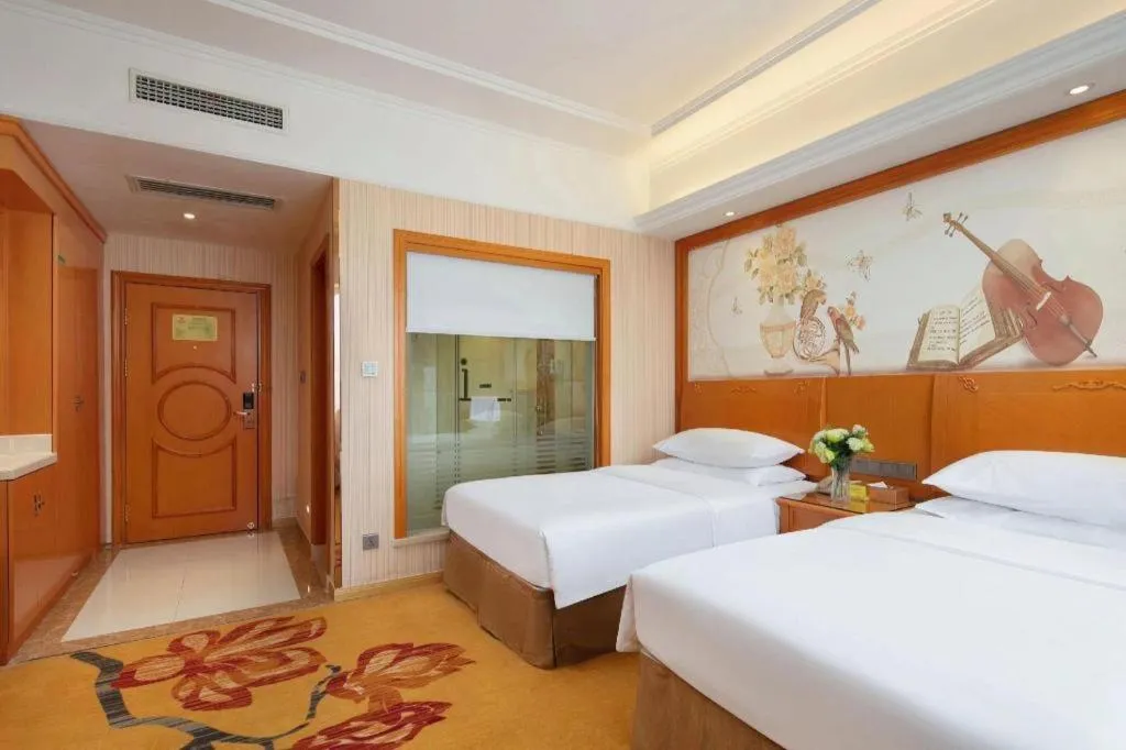 Bed in Vienna Hotel Xi'an Xijing Hospital Tonghuamen Metro Station