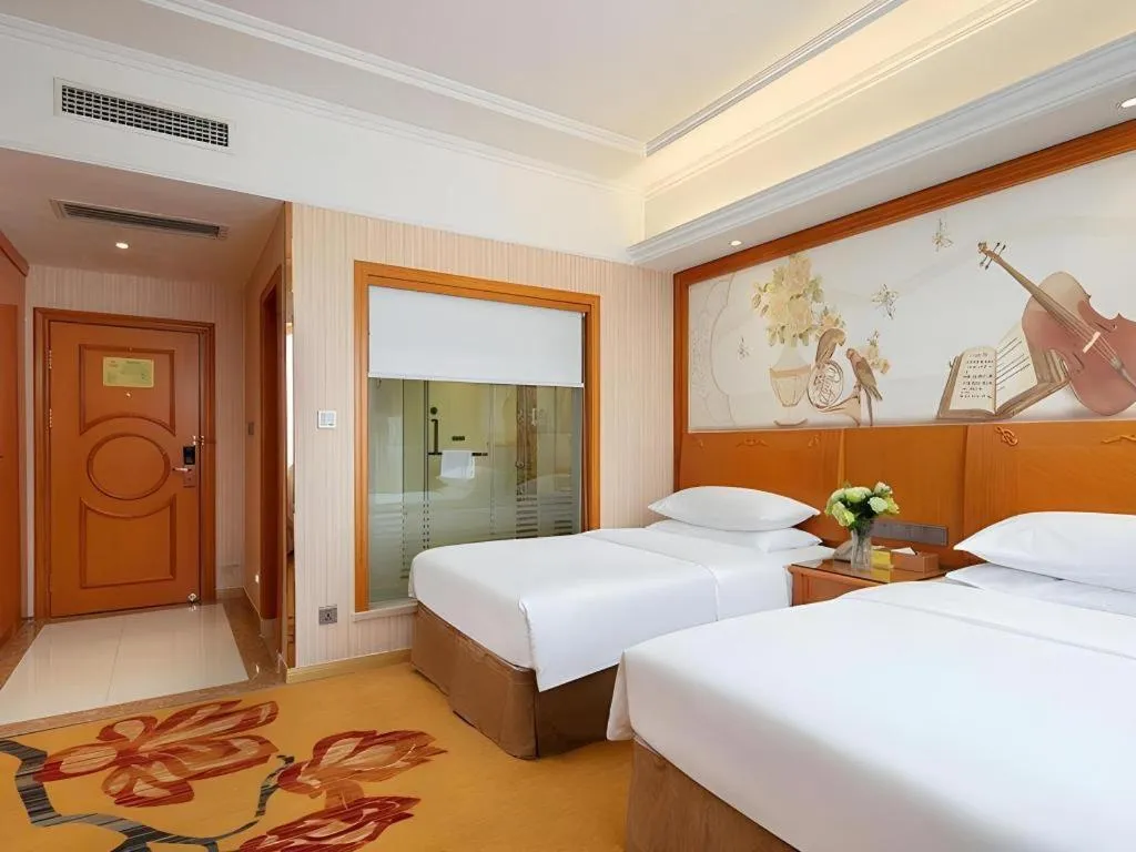 Bed in Vienna Hotel Xi'an Xijing Hospital Tonghuamen Metro Station