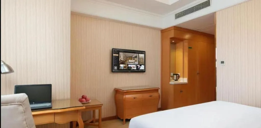 Bed in Vienna Hotel Xi'an Xijing Hospital Tonghuamen Metro Station