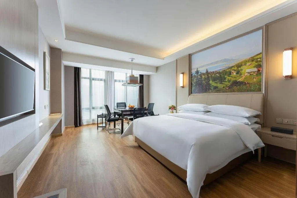 Bed in Vienna Hotel Jiangxi Fuzhou Yihuang