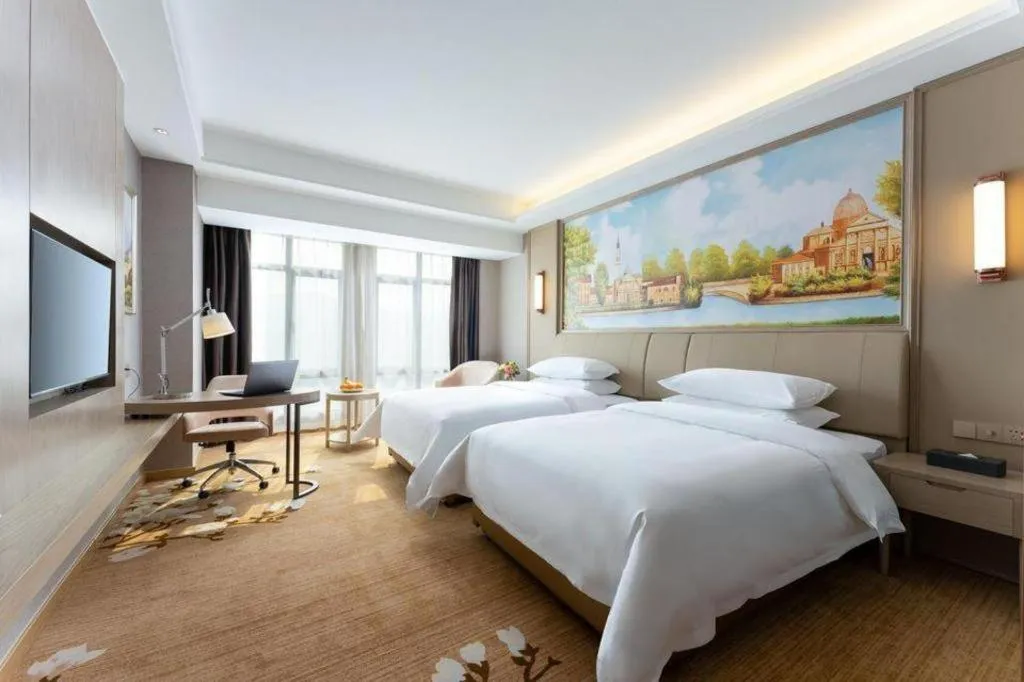 Bed in Vienna Hotel Jiangxi Fuzhou Yihuang