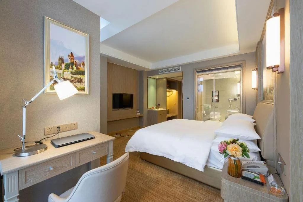 Bed in Vienna Hotel Jiangxi Fuzhou Yihuang