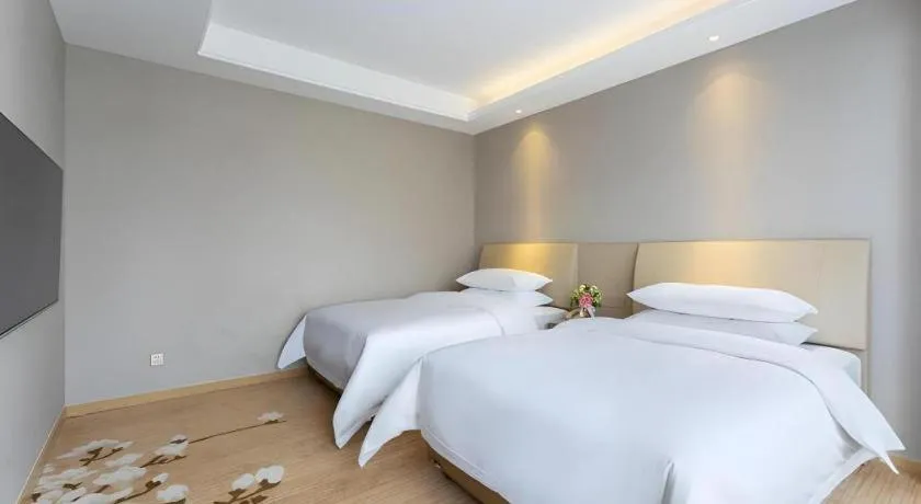 Bed in Vienna Hotel Jiangxi Fuzhou Yihuang