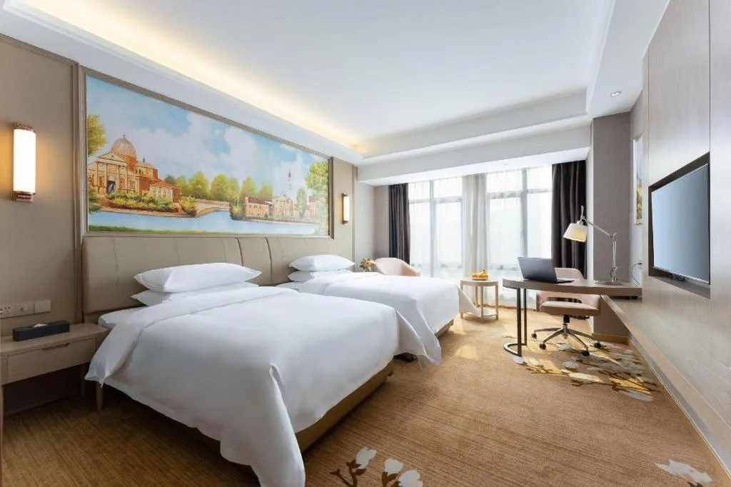 Bed in Vienna Hotel Jiangxi Fuzhou Yihuang