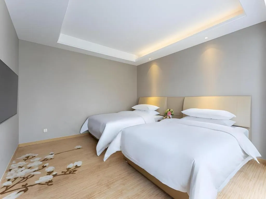 Bed in Vienna Hotel Jiangxi Fuzhou Yihuang