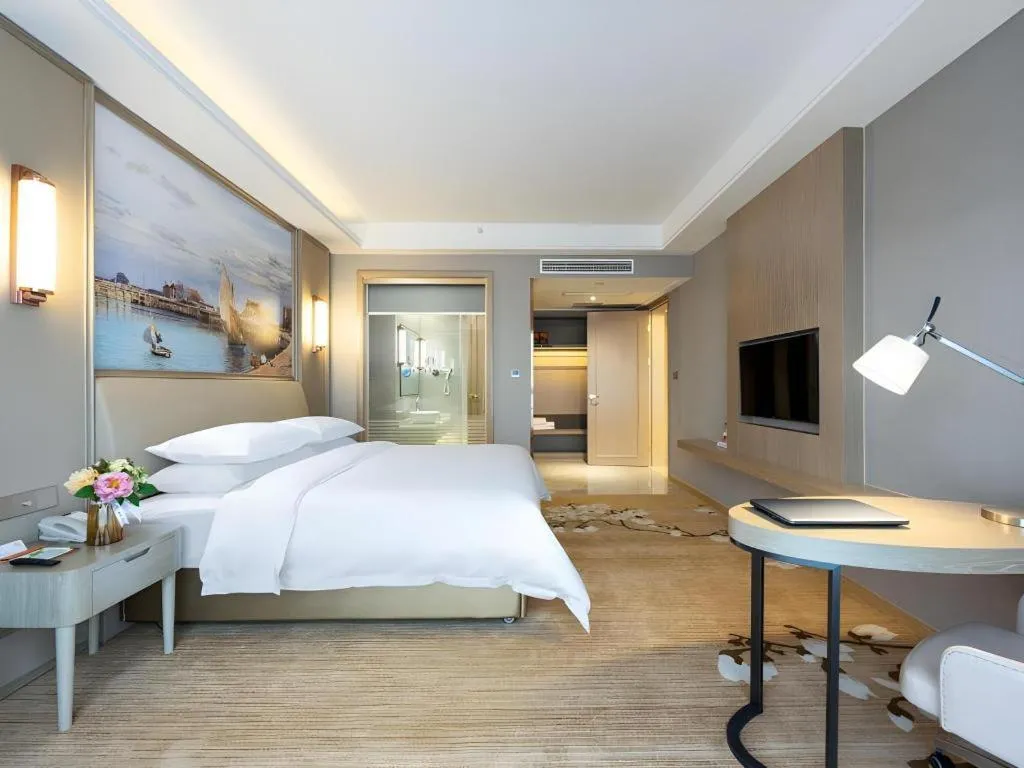 Bed in Vienna Hotel Jiangxi Fuzhou Yihuang