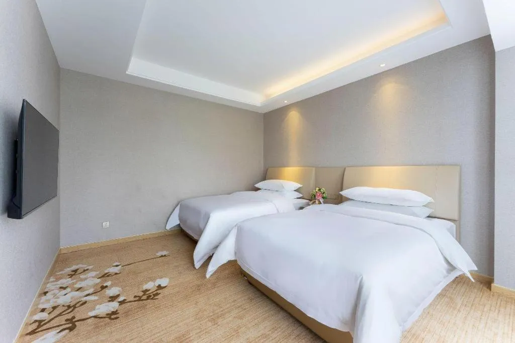 Bed in Vienna Hotel Jiangxi Fuzhou Yihuang