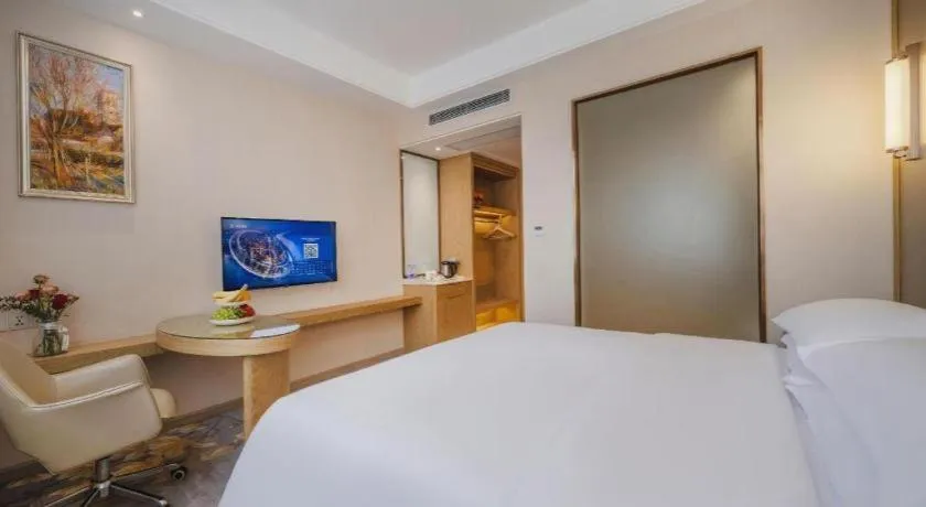 Bed in Vienna Hotel Shenzhen Pingshan Longtian Town