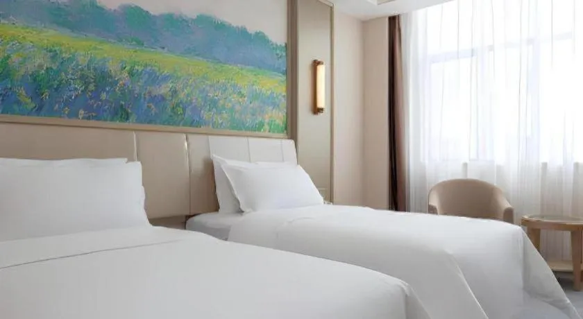 Bed in Vienna Hotel Shenzhen Pingshan Longtian Town