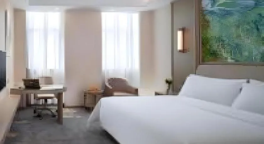 Bed in Vienna Hotel Shenzhen Pingshan Longtian Town