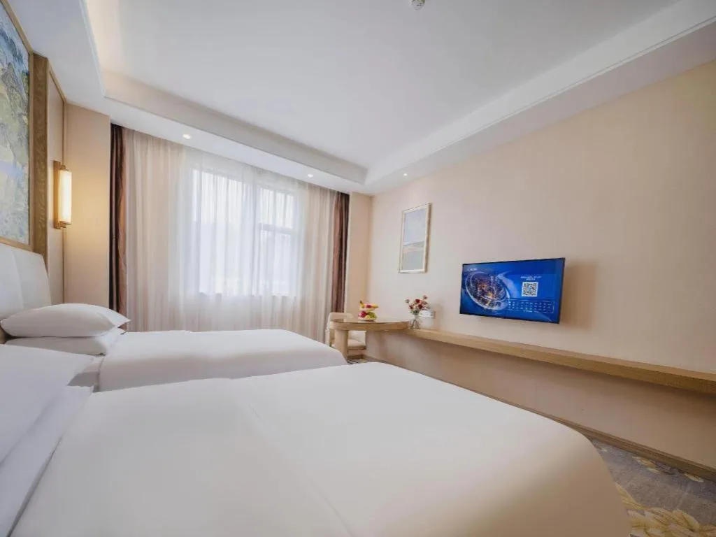 Bed in Vienna Hotel Shenzhen Pingshan Longtian Town