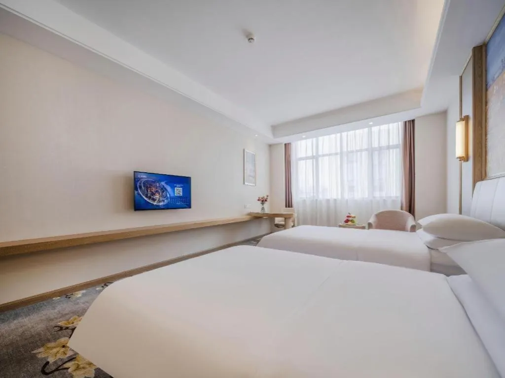 Bed in Vienna Hotel Shenzhen Pingshan Longtian Town