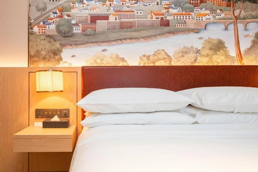 Bed in Vienna Hotel Chongqing Wushan Municipal Government