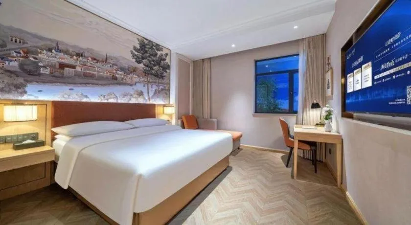 Bed in Vienna Hotel Chongqing Wushan Municipal Government