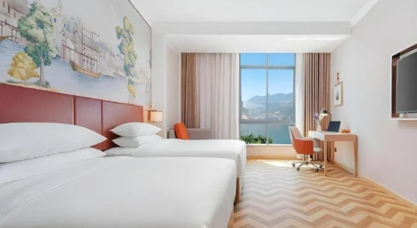 Bed in Vienna Hotel Chongqing Wushan Municipal Government