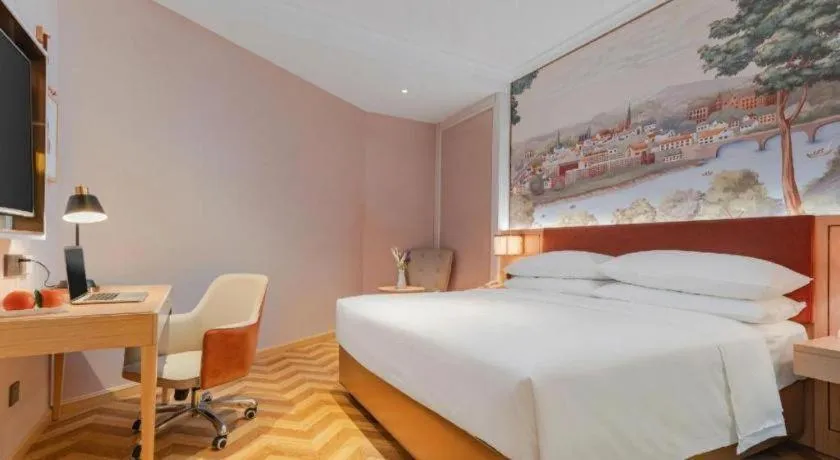 Bed in Vienna Hotel Chongqing Wushan Municipal Government