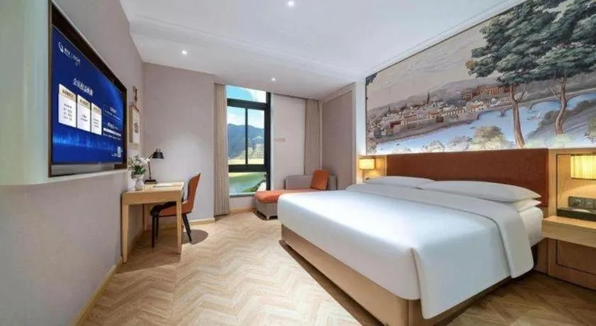 Bed in Vienna Hotel Chongqing Wushan Municipal Government