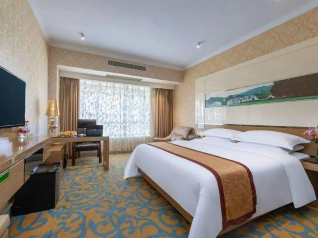 Bed in Vienna Hotel Guangdong Zhuhai Mingzhu Station Guozheng