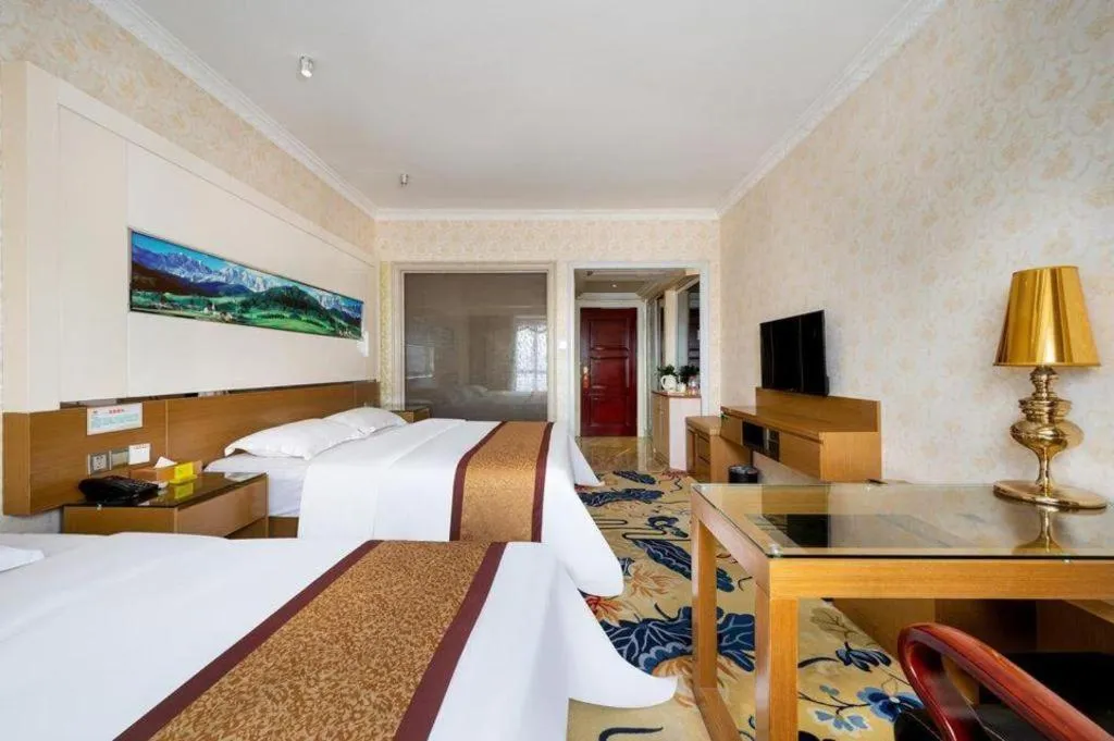 Bed in Vienna Hotel Guangdong Zhuhai Mingzhu Station Guozheng