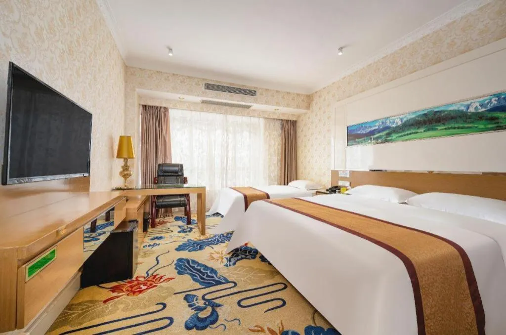 Bed in Vienna Hotel Guangdong Zhuhai Mingzhu Station Guozheng