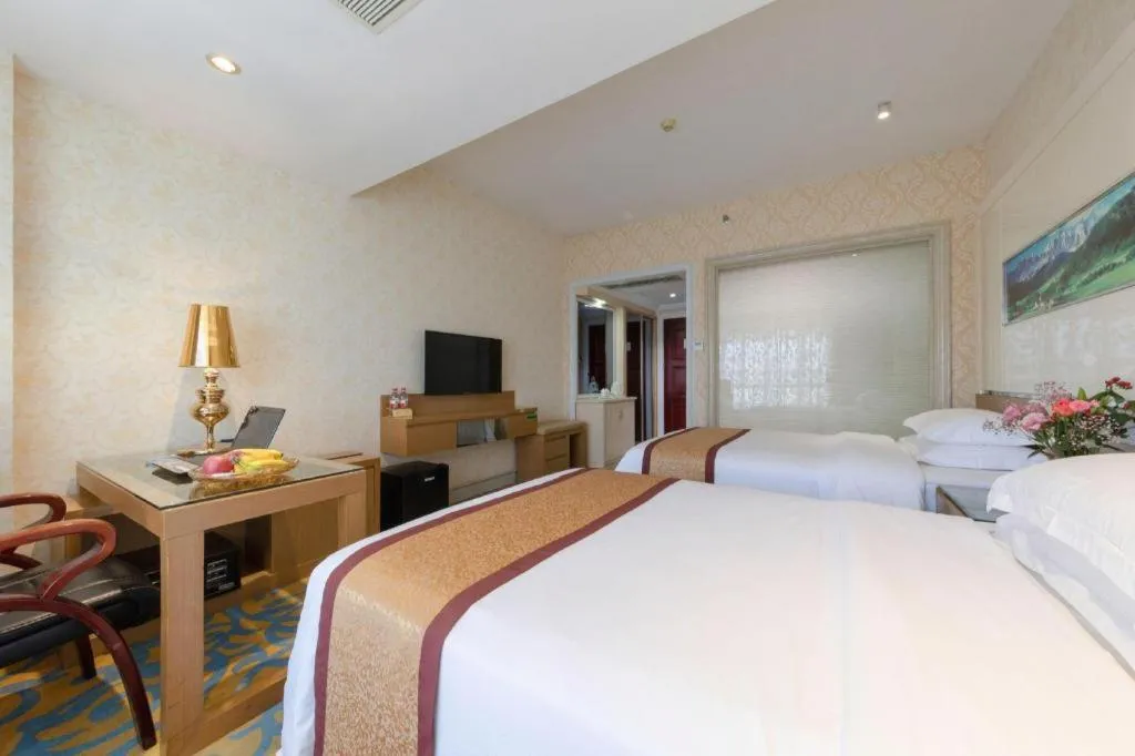 Bed in Vienna Hotel Guangdong Zhuhai Mingzhu Station Guozheng