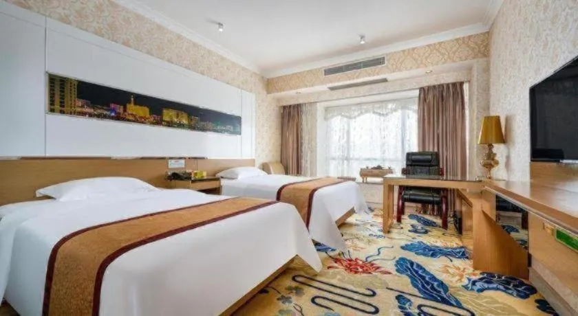Bed in Vienna Hotel Guangdong Zhuhai Mingzhu Station Guozheng
