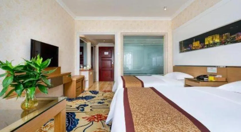 Bed in Vienna Hotel Guangdong Zhuhai Mingzhu Station Guozheng
