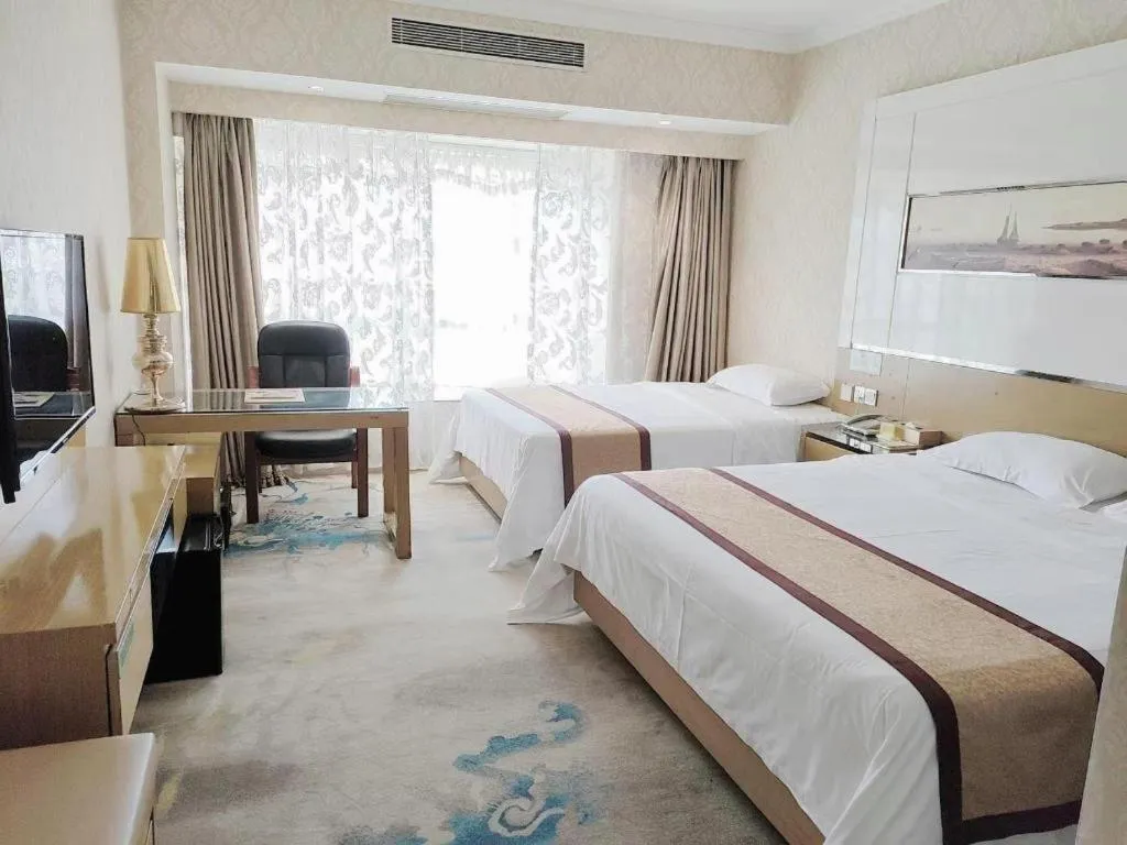 Bed in Vienna Hotel Guangdong Zhuhai Mingzhu Station Guozheng