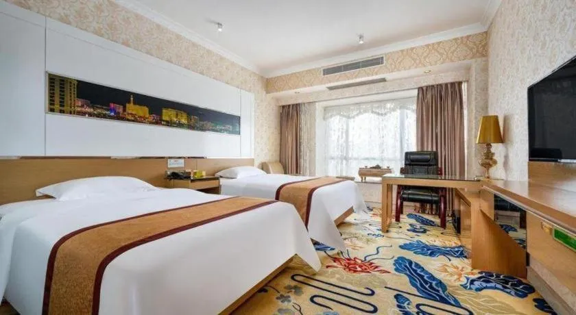 Bed in Vienna Hotel Guangdong Zhuhai Mingzhu Station Guozheng