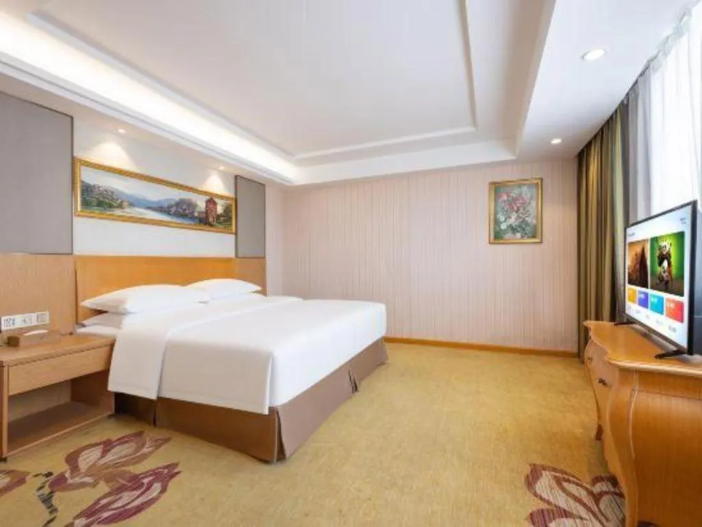 Bed in Vienna Hotel Guangzhou Baiyun Airport Huadu Avenue