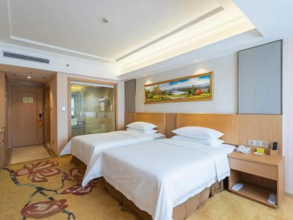 Bed in Vienna Hotel Guangzhou Baiyun Airport Huadu Avenue