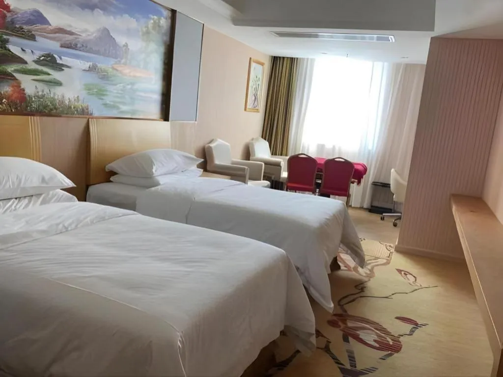 Bed in Vienna Hotel Guangzhou Baiyun Airport Huadu Avenue