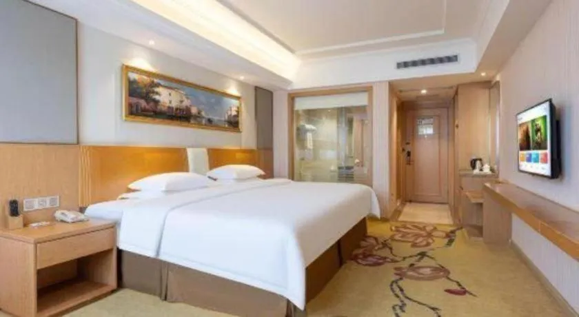 Bed in Vienna Hotel Guangzhou Baiyun Airport Huadu Avenue