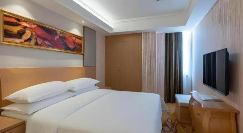 Bed in Vienna Hotel Guangzhou Baiyun Airport Huadu Avenue
