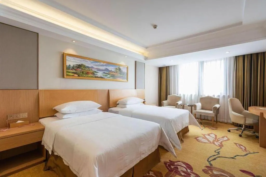 Bed in Vienna Hotel Guangzhou Baiyun Airport Huadu Avenue
