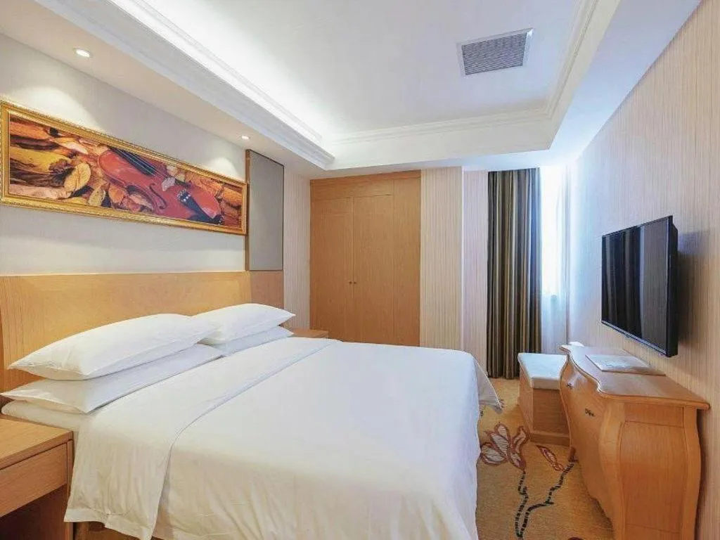 Bed in Vienna Hotel Guangzhou Baiyun Airport Huadu Avenue