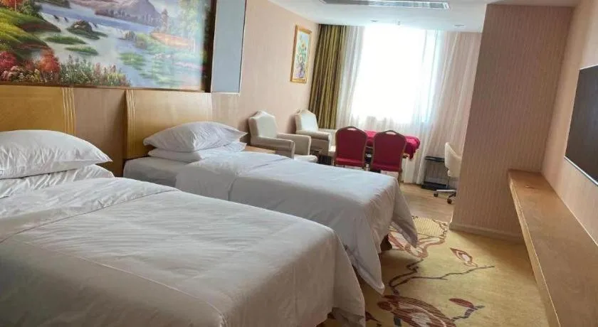 Bed in Vienna Hotel Guangzhou Baiyun Airport Huadu Avenue
