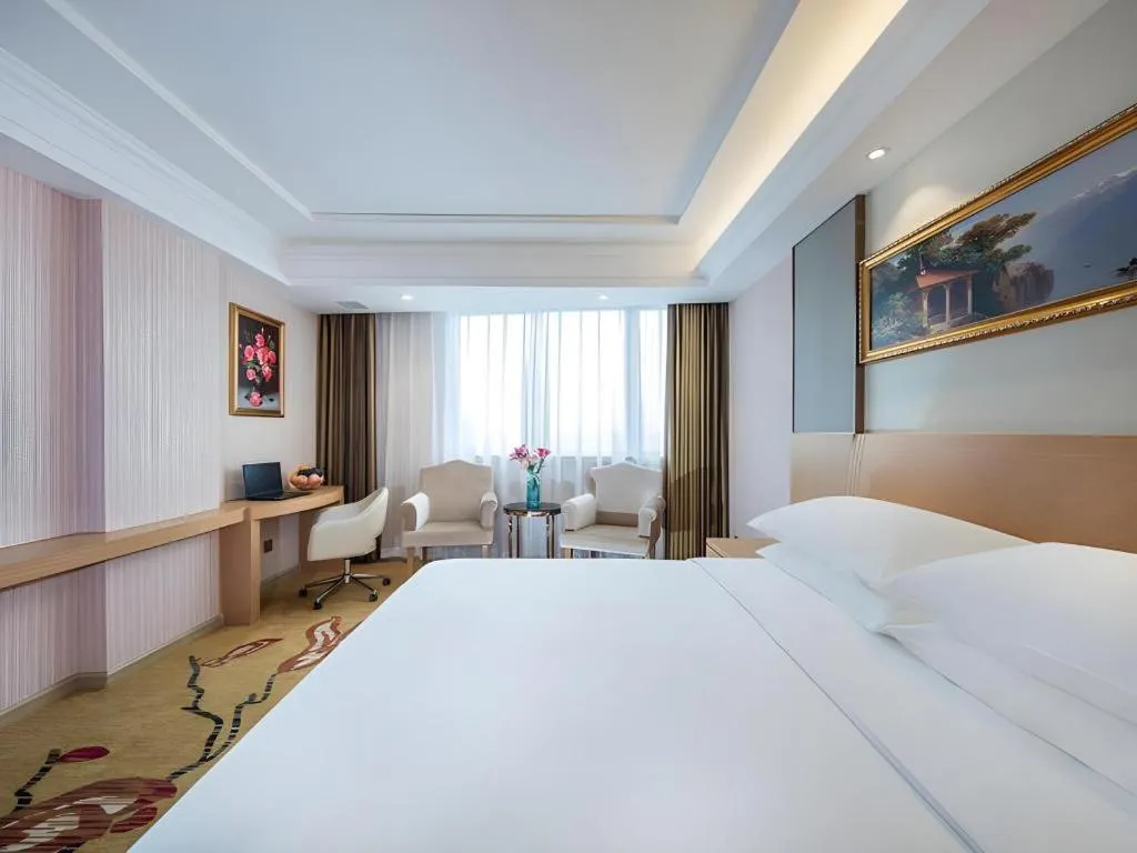 Bed in Vienna Hotel Guangzhou Baiyun Airport Huadu Avenue