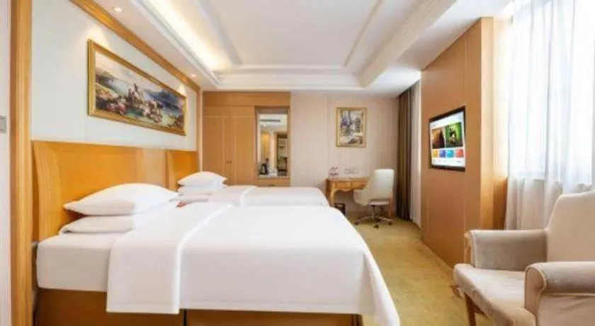 Bed in Vienna Hotel Guangzhou Baiyun Airport Huadu Avenue