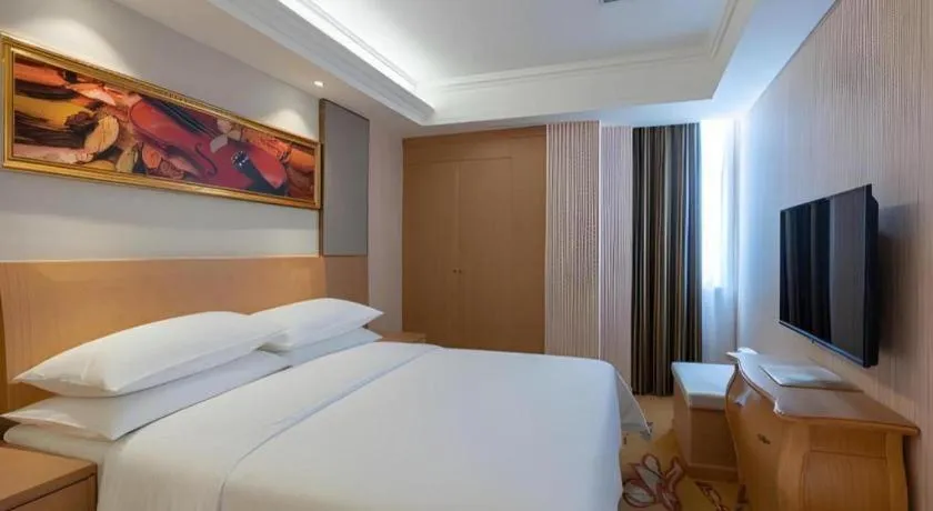 Bed in Vienna Hotel Guangzhou Baiyun Airport Huadu Avenue