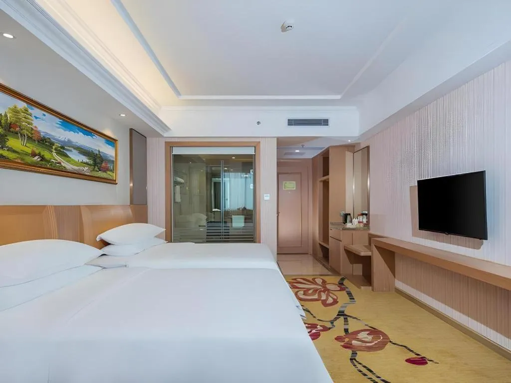 Bed in Vienna Hotel Guangzhou Baiyun Airport Huadu Avenue