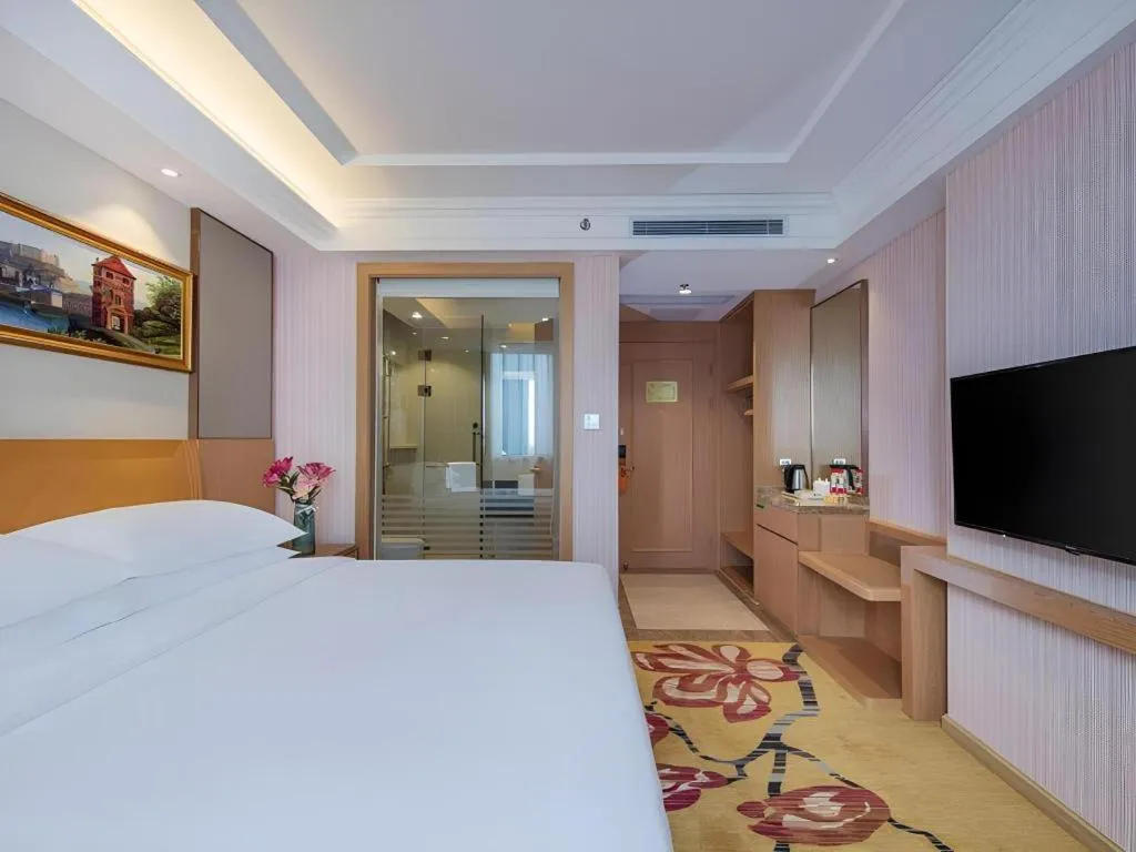 Bed in Vienna Hotel Guangzhou Baiyun Airport Huadu Avenue