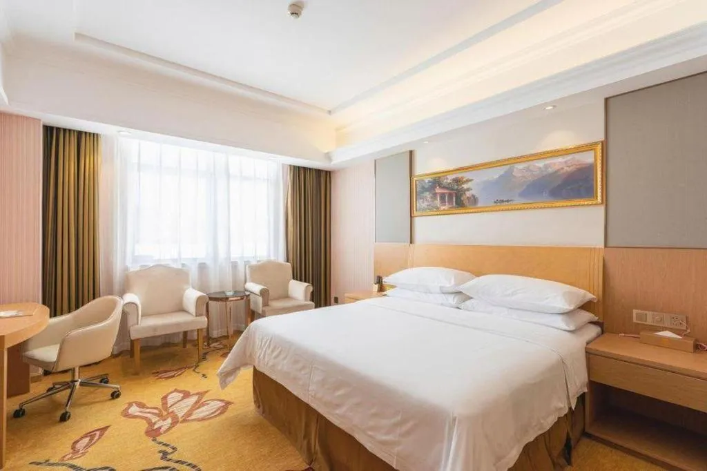 Bed in Vienna Hotel Guangzhou Baiyun Airport Huadu Avenue