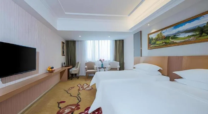 Bed in Vienna Hotel Guangzhou Baiyun Airport Huadu Avenue