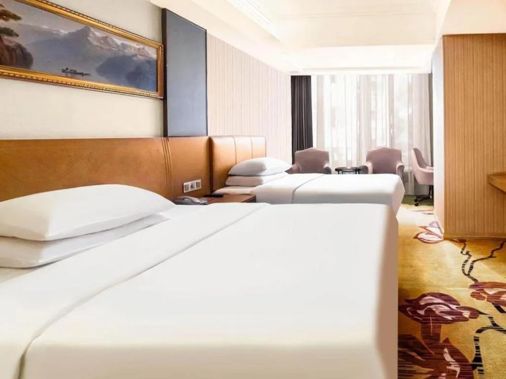 Bed in Vienna Hotel Guangzhou Baiyun Airport Huadu Avenue