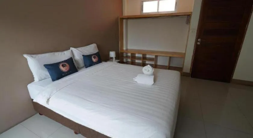 Bed in RoomQuest Chiang Mai Tha Sala