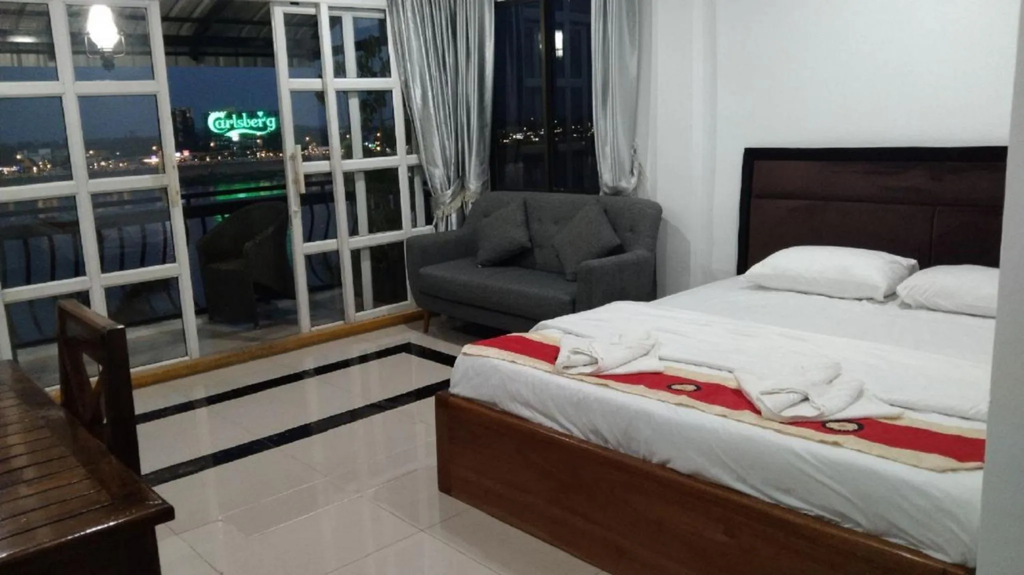 Bed in New Season Riverside Hotel