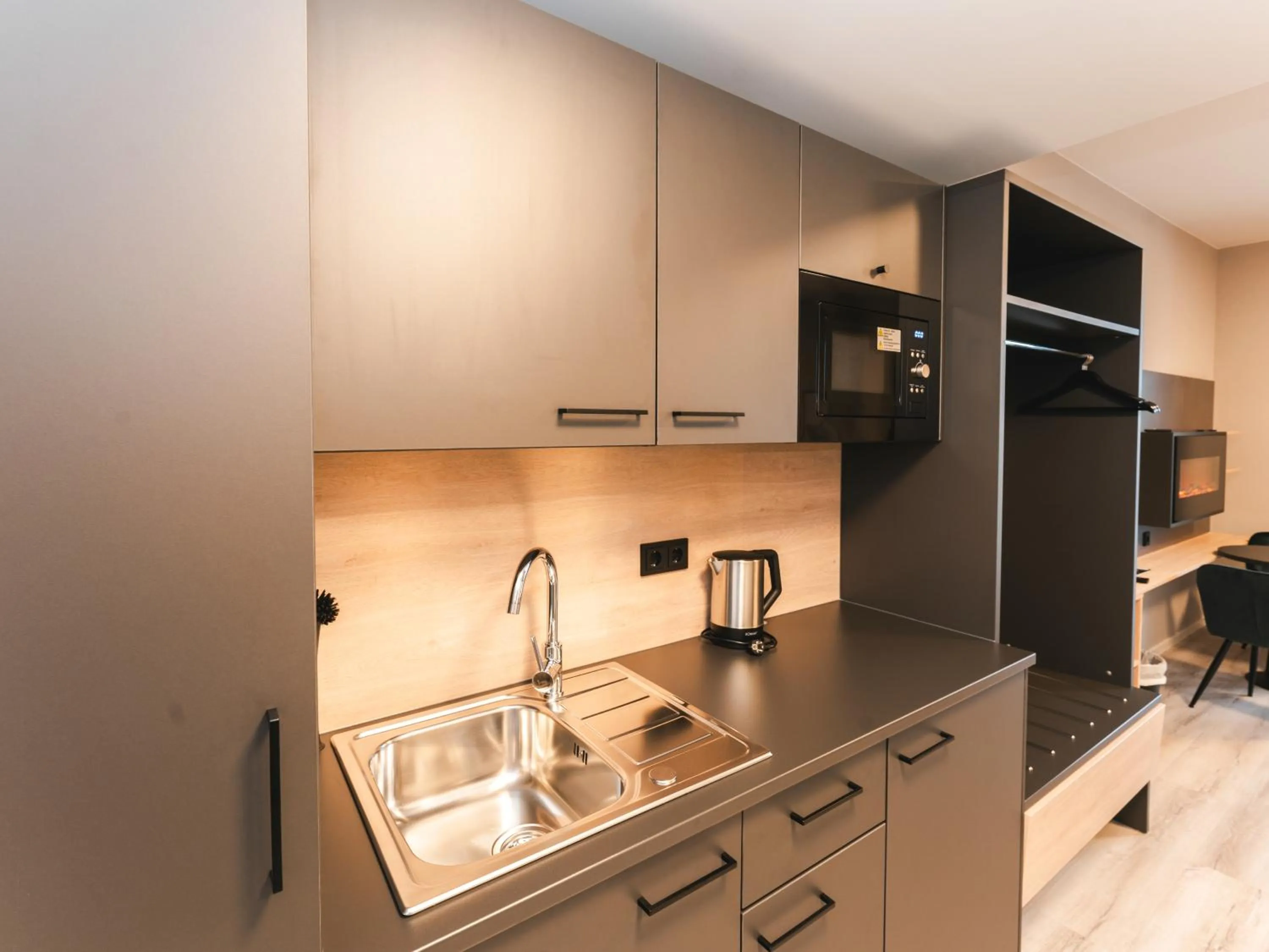 Kitchen or kitchenette in JustStay München Hotel & Apartments