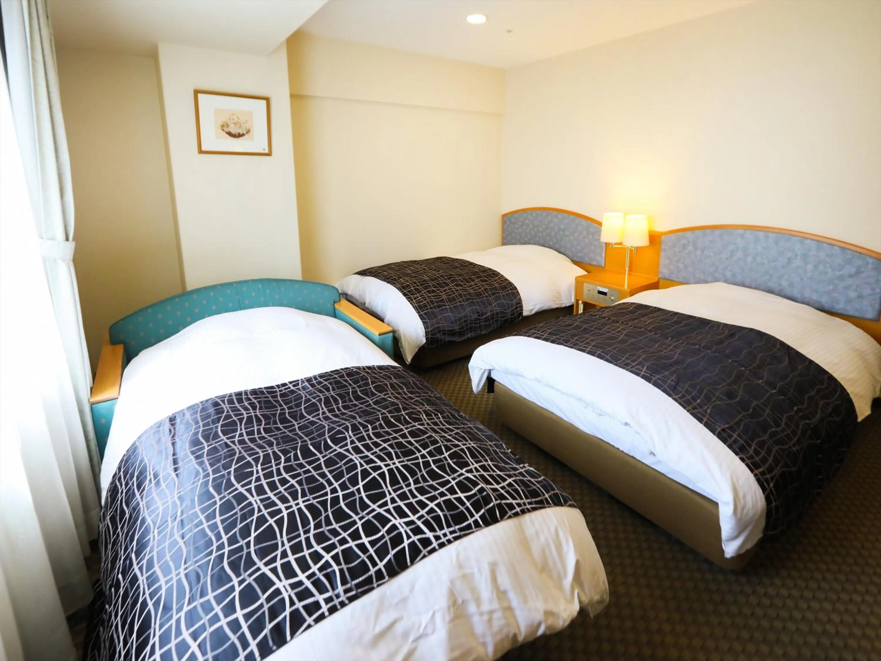 Photo of the whole room, Bed in APA Hotel Obihiro Ekimae